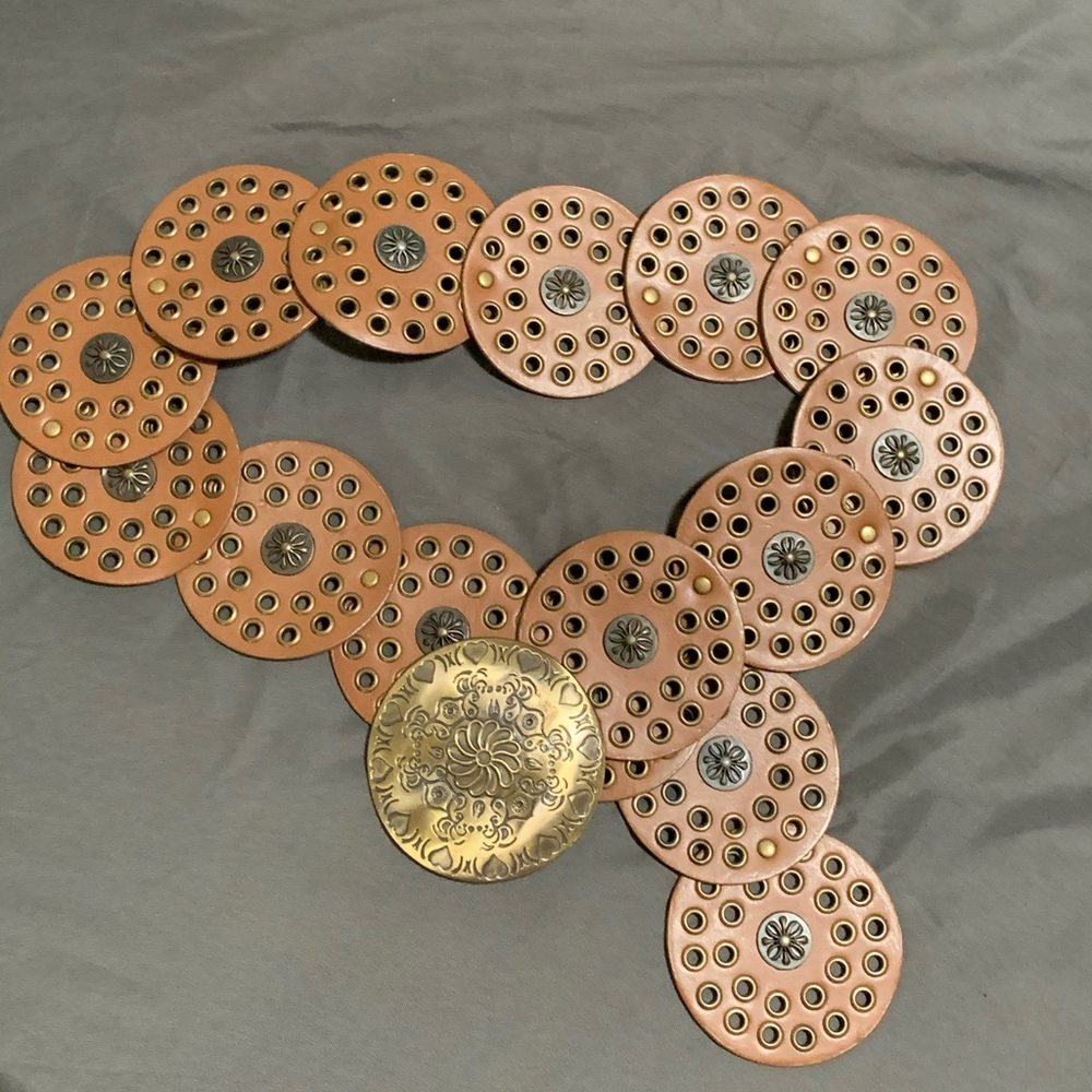 Circular leather belt with large bronze buckle